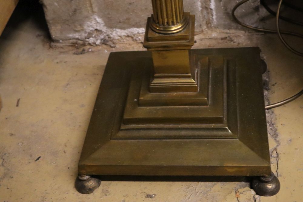 A brass Corinthian column adjustable standard lamp